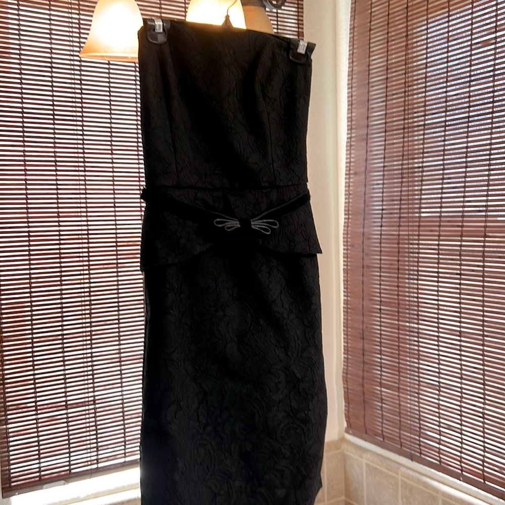 Beautiful black strapless cocktail dress. Only wore once to a Christmas party.